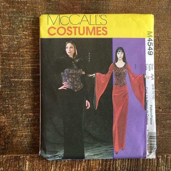 McCalls Sewing Pattern M4549 Gothic Morticia Corset Capelet Dress 6-12 UNCUT - Picture 1 of 4